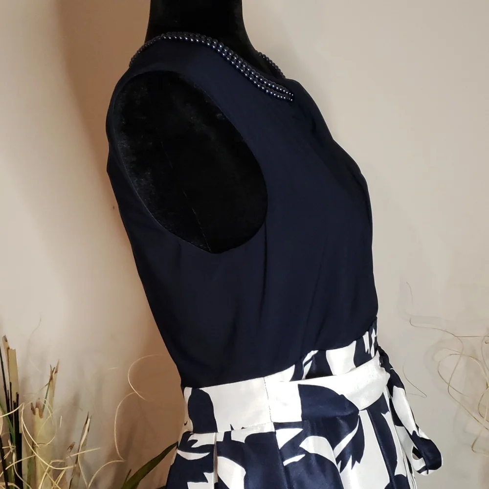High-low navy blue and white dress, with two strands of navy blue pearls. - Picture 7 of 9